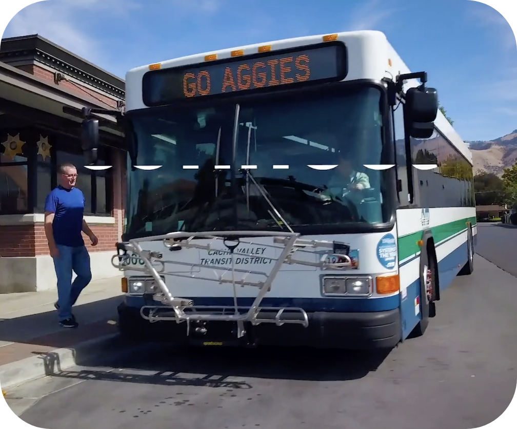 Man boarding bus at bus stop