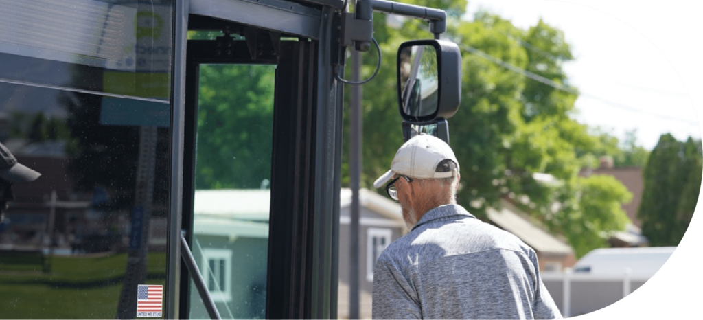 man boarding a connect transit bus